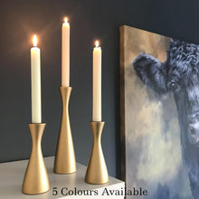 Load image into Gallery viewer, Gold wooden candlesticks with ivory candles