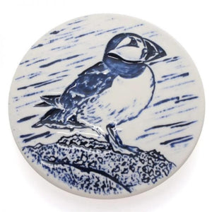 coaster with puffin image hand finished with blue paint